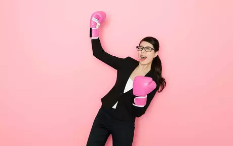 woman with pink boxing gloves