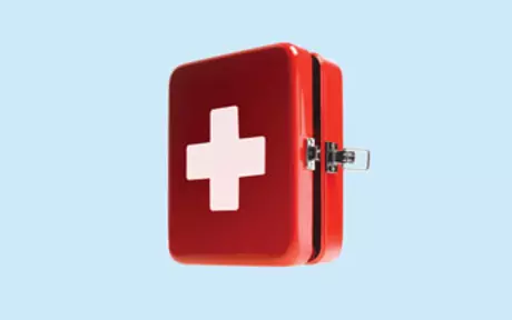 First aid kit on blue background