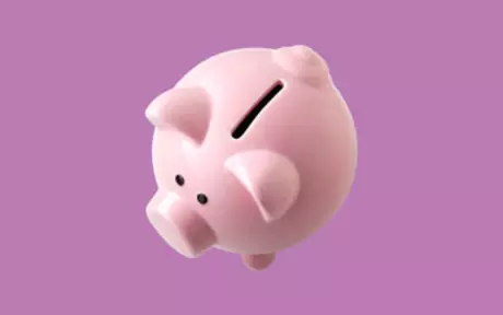 Piggy bank on purple background
