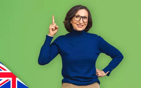 Smiling woman with glasses on green background