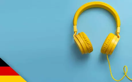 A pair of yellow headphones on a blue background