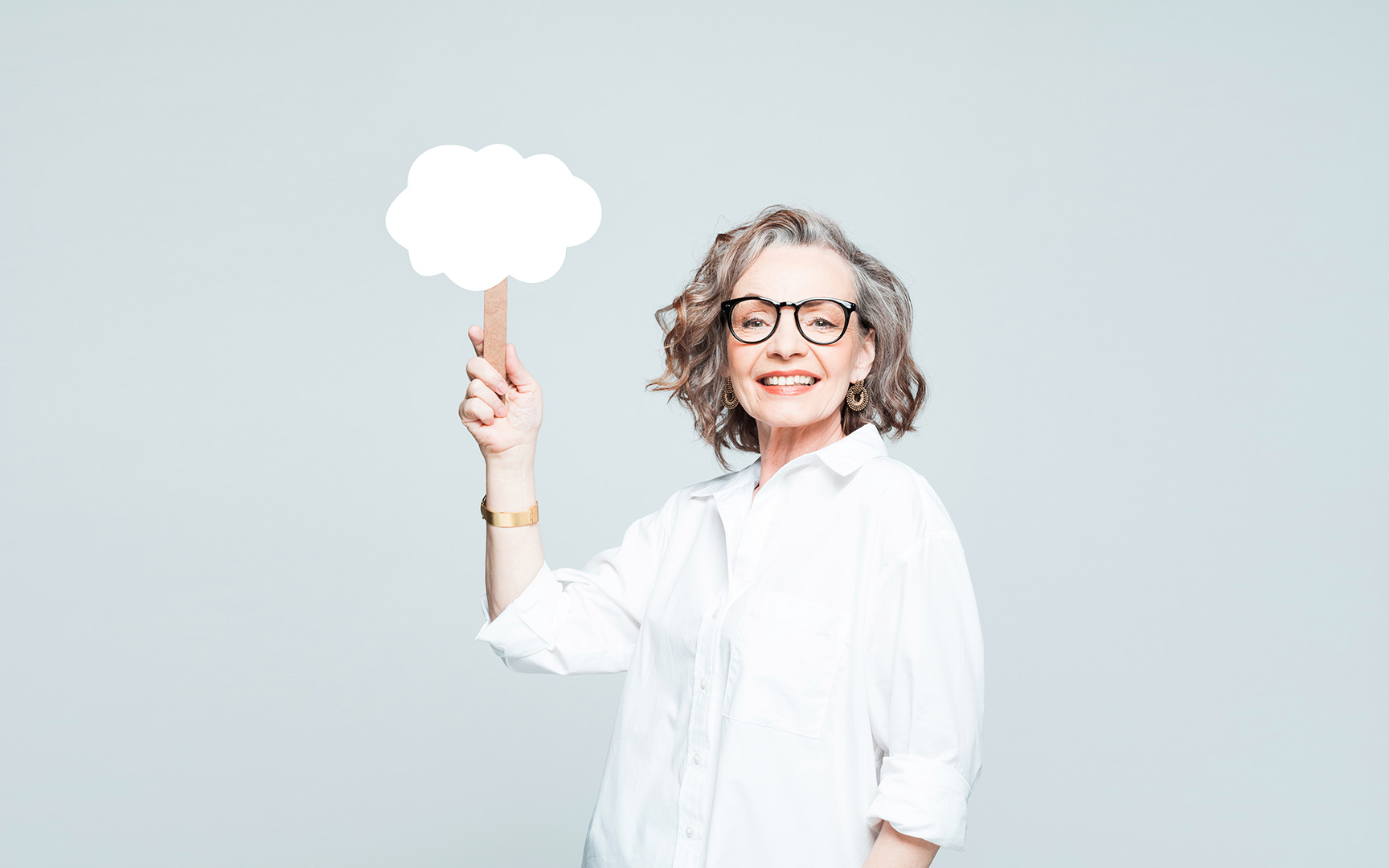 woman holding up cloud sign