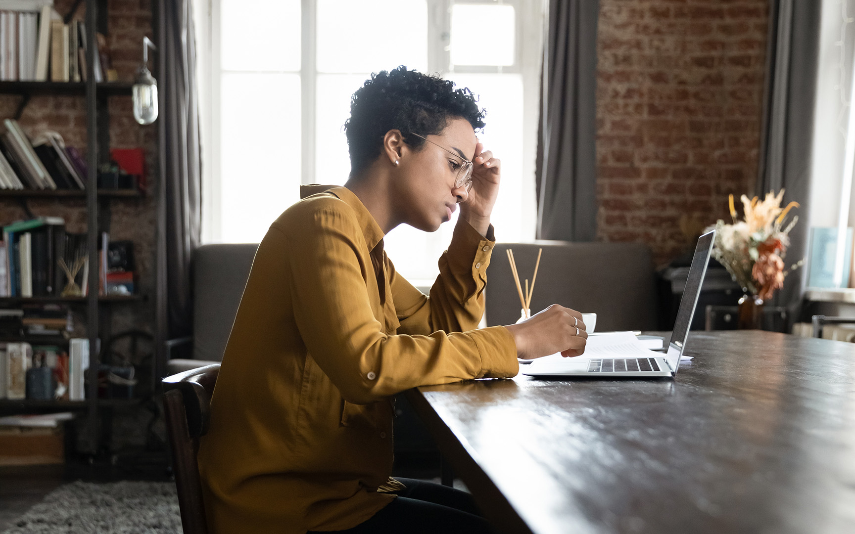Woman looking at laptop