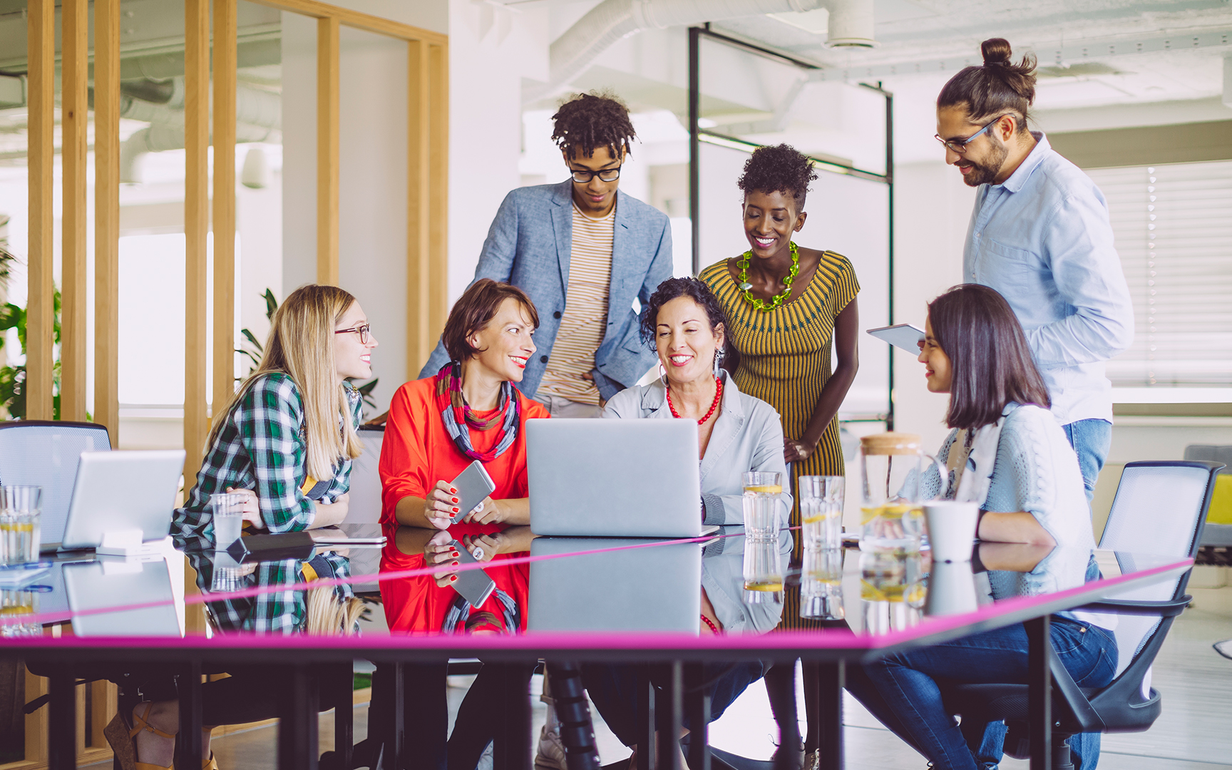 People diversity around a computer in an office