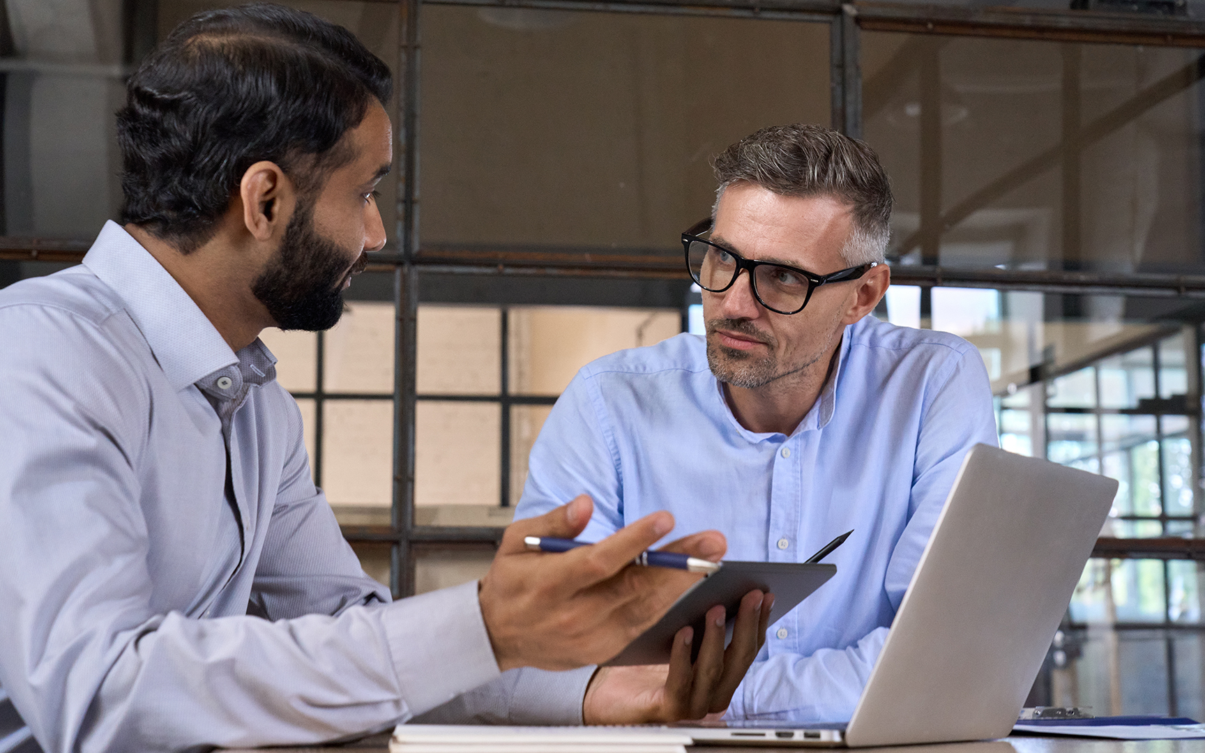 Two men talking together 