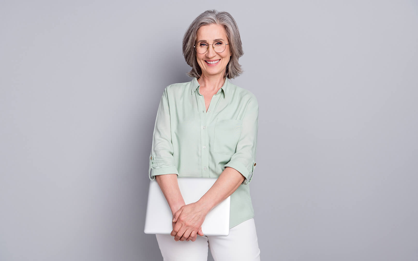 woman holding a laptop