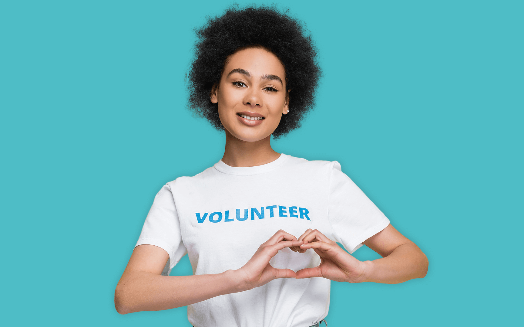 volunteer woman making heart with hands