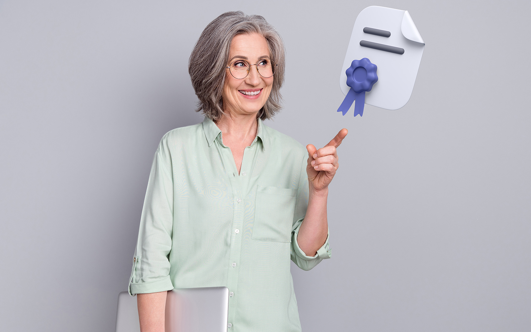woman pointing to a diploma