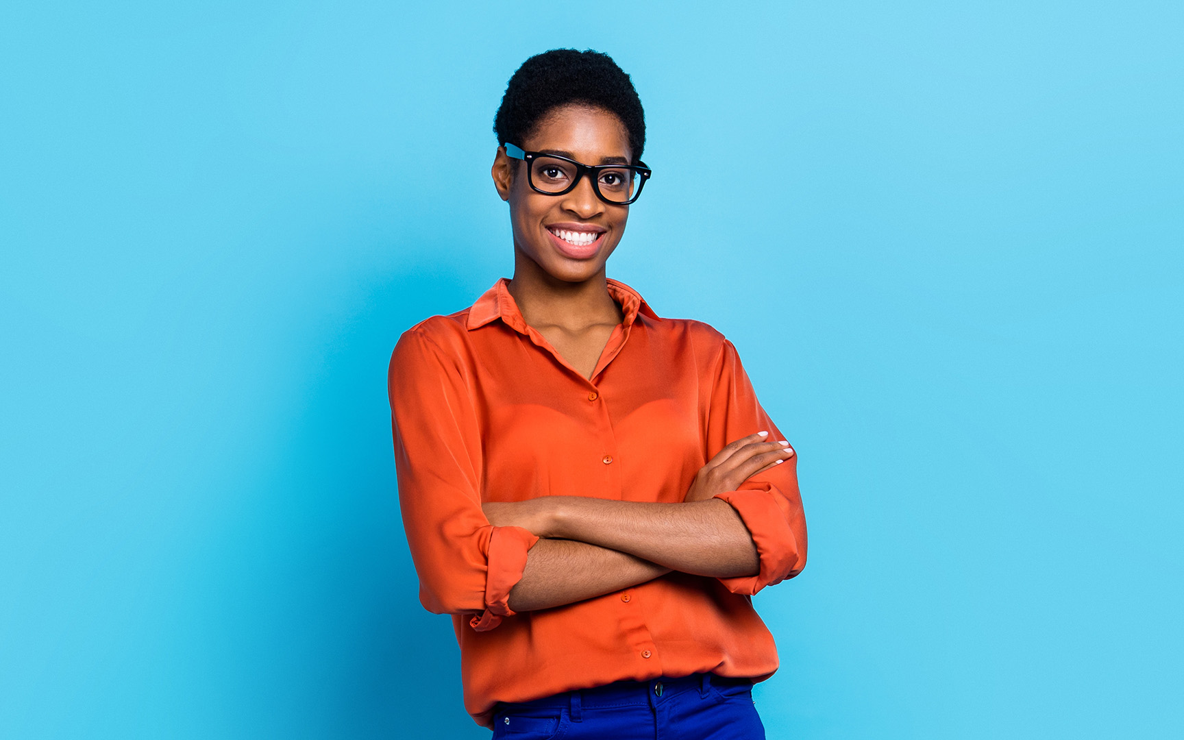 woman with orange shirt and blue background