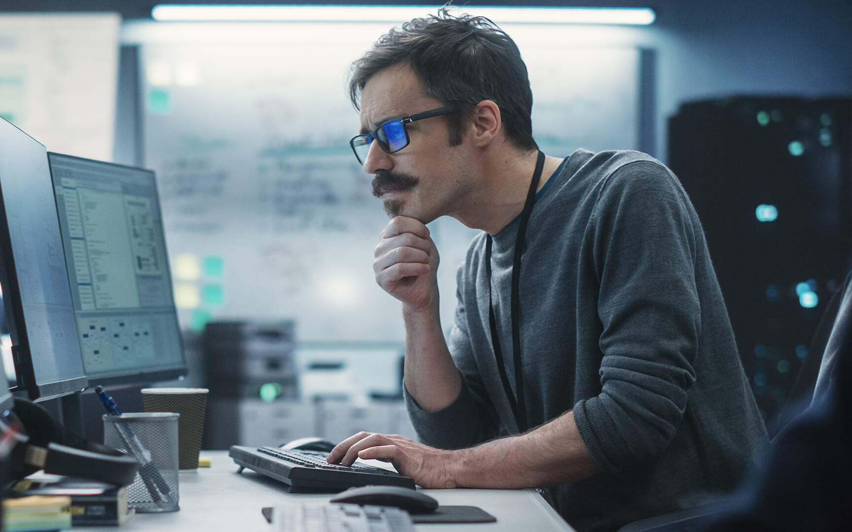 men sitting in front of a computer