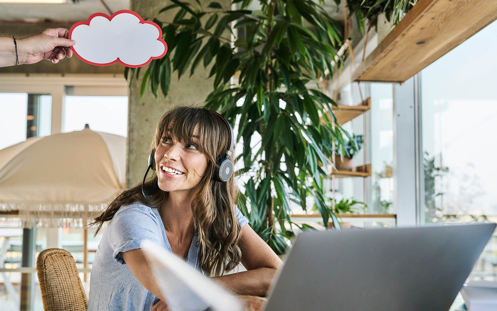 young woman with a laptop in front of her
