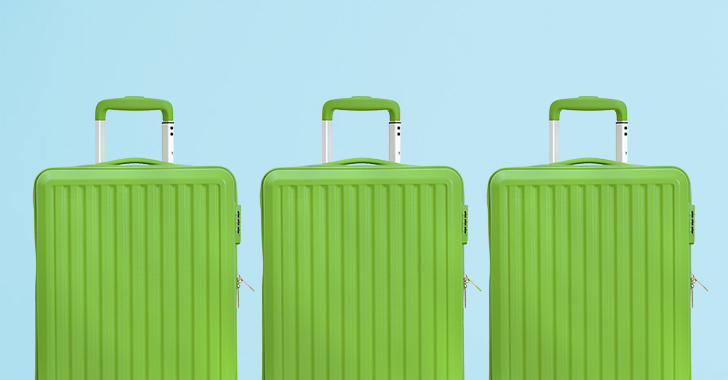 Three green hard-shell suitcases lined up against a light blue background