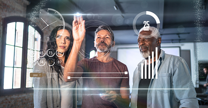 Three professionals in a modern office setting interact with glowing holographic data displays.