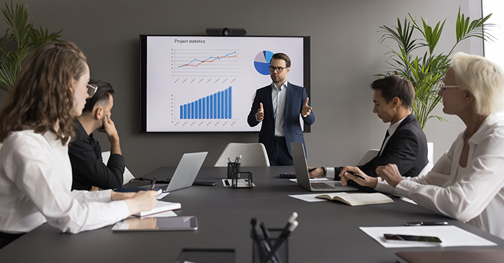 A professional business meeting in a modern conference room.
