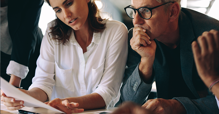 people reviewing a document