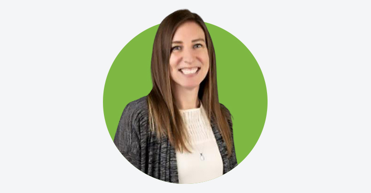 Professional portrait of a woman wearing a light top and dark cardigan, standing against a green circular background.