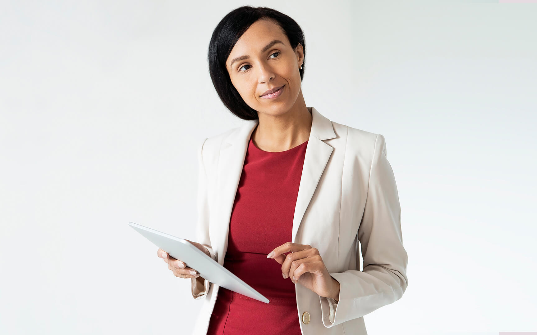 Smart dressed woman holding a tablet
