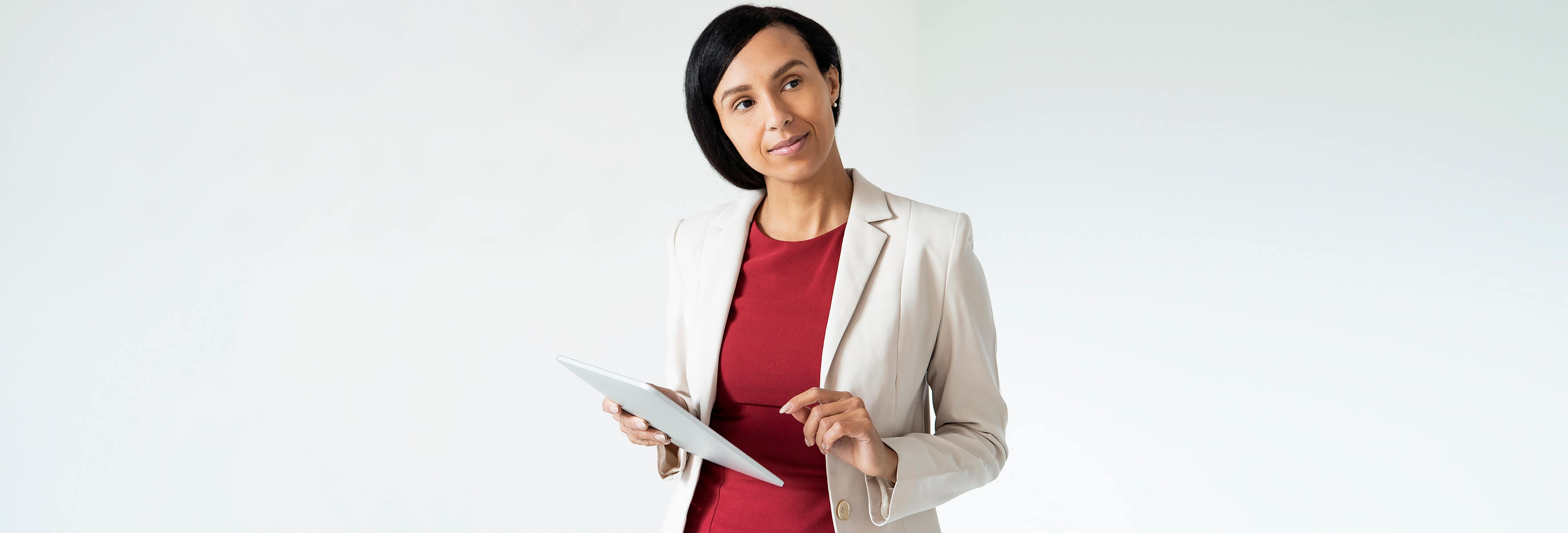 Smart dressed woman holding a tablet