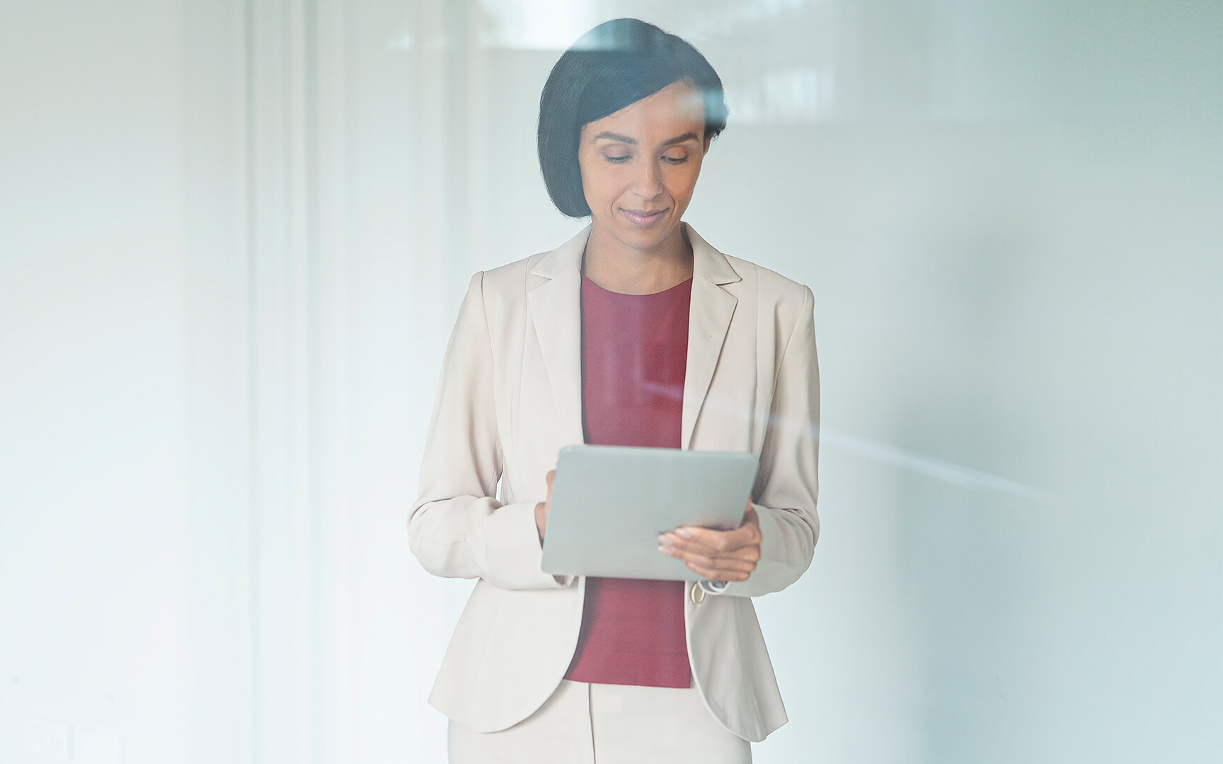 Smart dressed women holding a tablet