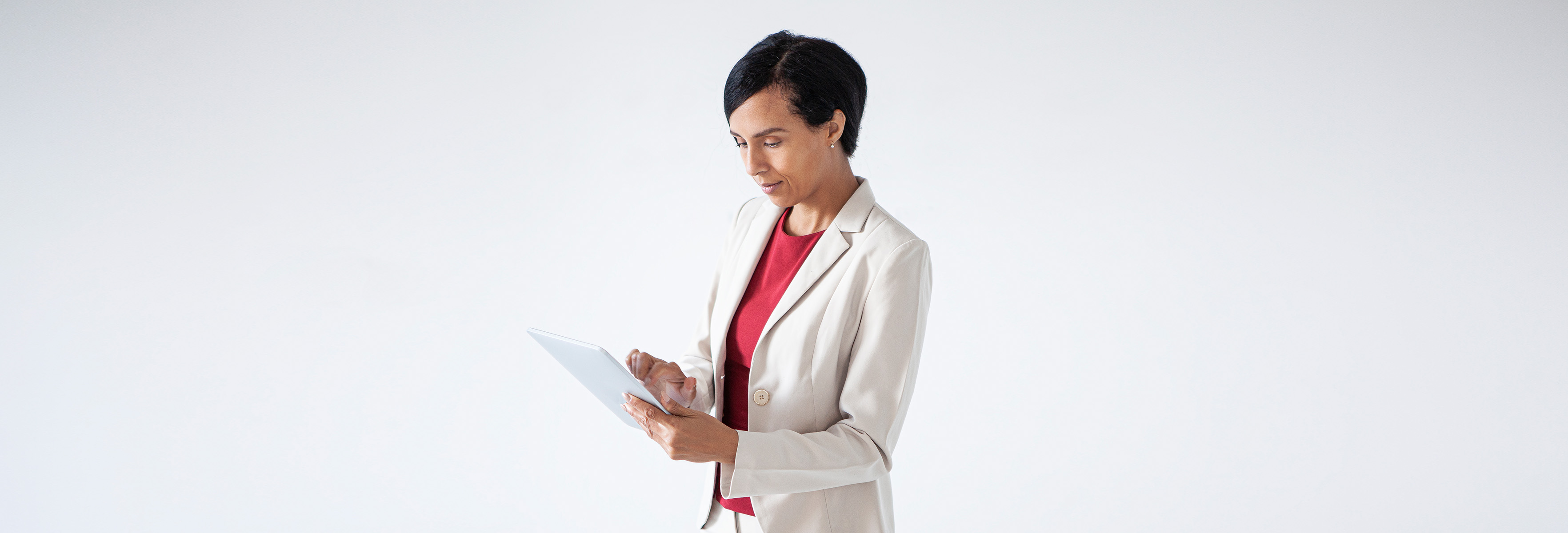 Smart dressed woman looking at her tablet