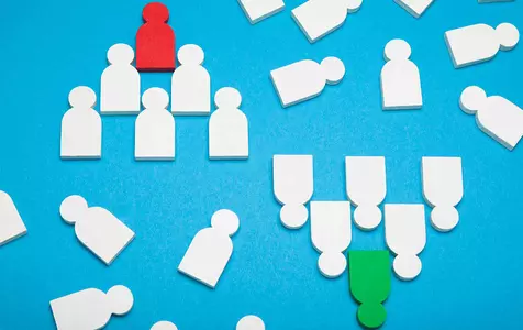 image of cut outs representing people. The people are presented in separate groups