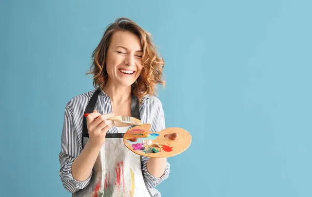 woman holding painting plate