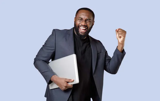 person cheering with laptop 