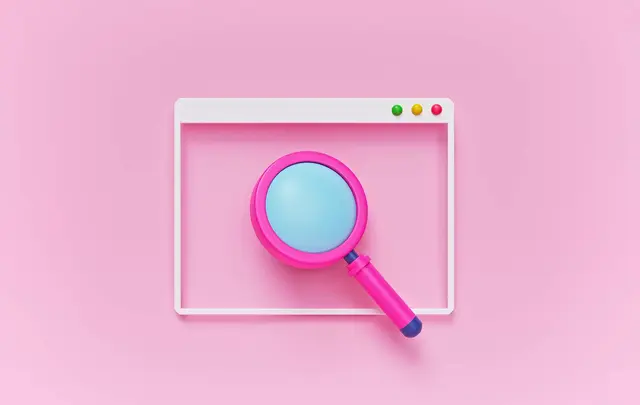 magnifying glass on pink background