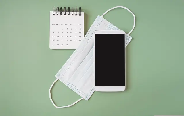 mask with phone and calendar