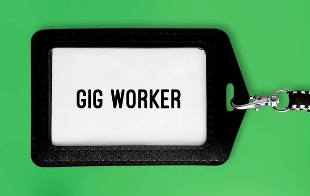 gig worker tag on chain with green background 