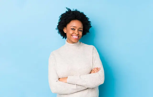 woman with white sweater and arms crossed