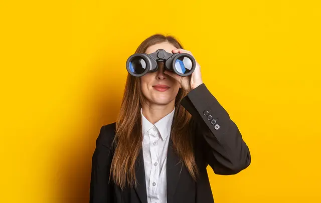 person with binoculars