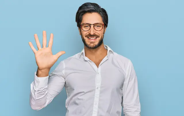 man with glasses waving