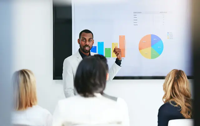 business people looking at presentation