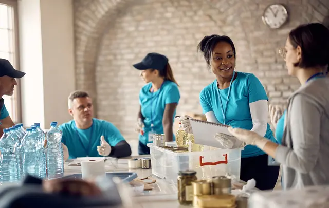 people working going through donations