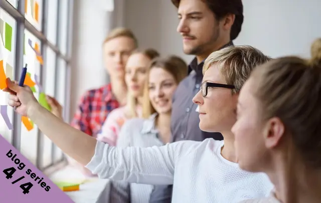 team looking at sticky notes