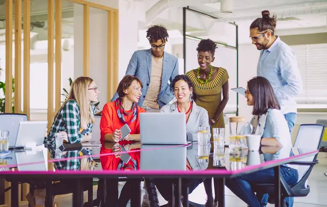 People diversity around a computer in an office