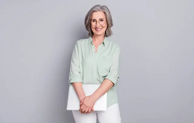 woman holding a laptop