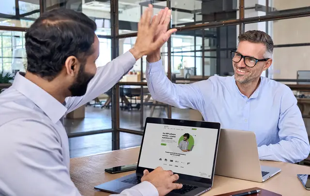 men celebrating in a meeting
