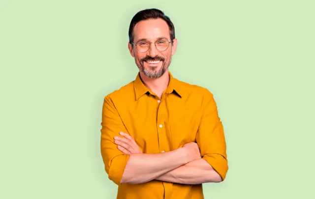 men with orange shirt smiling