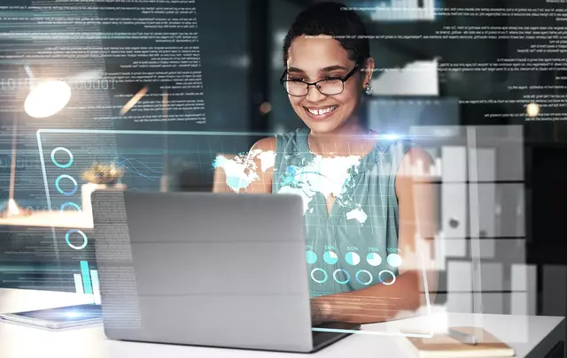 woman smiling with a laptop