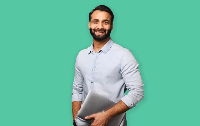men smiling and caring a laptop
