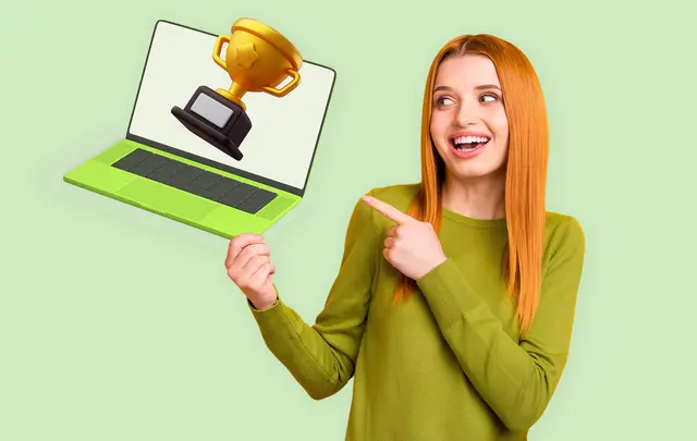 woman pointing to a laptop with an award