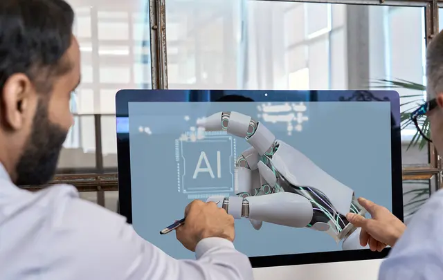 men pointing to a computer with ai in the laptop