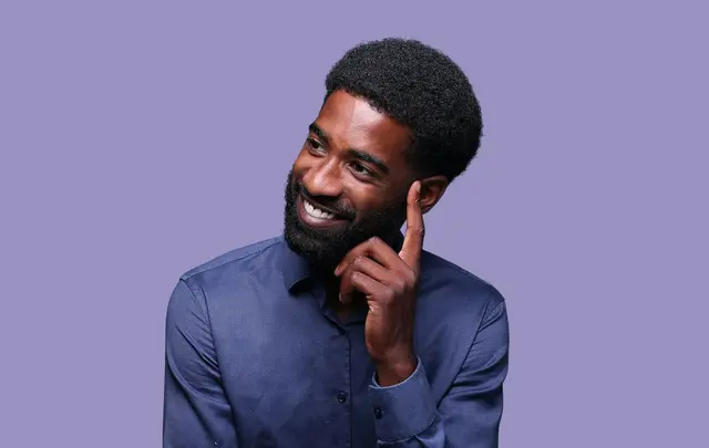 black men thinking with his hand in his head