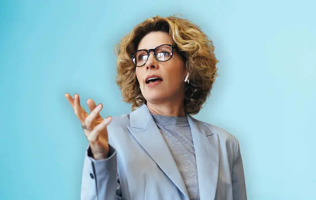 woman pointing with a blue background