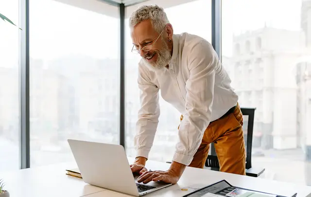 men in from of a laptop