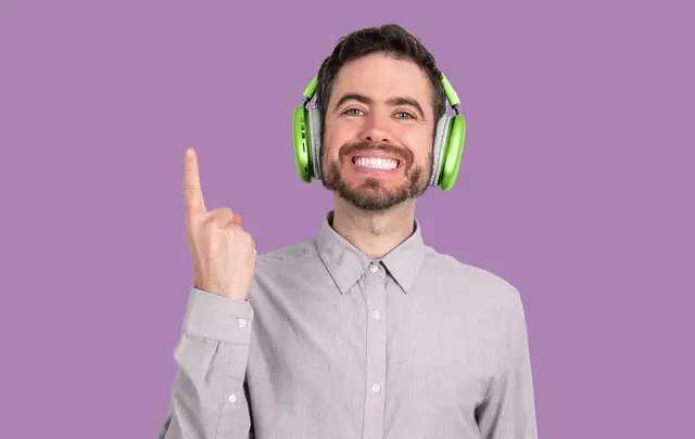 men smiling and pointing his finger up