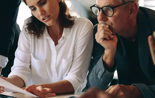 people reviewing a document