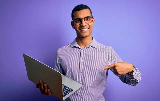 person pointing at computer